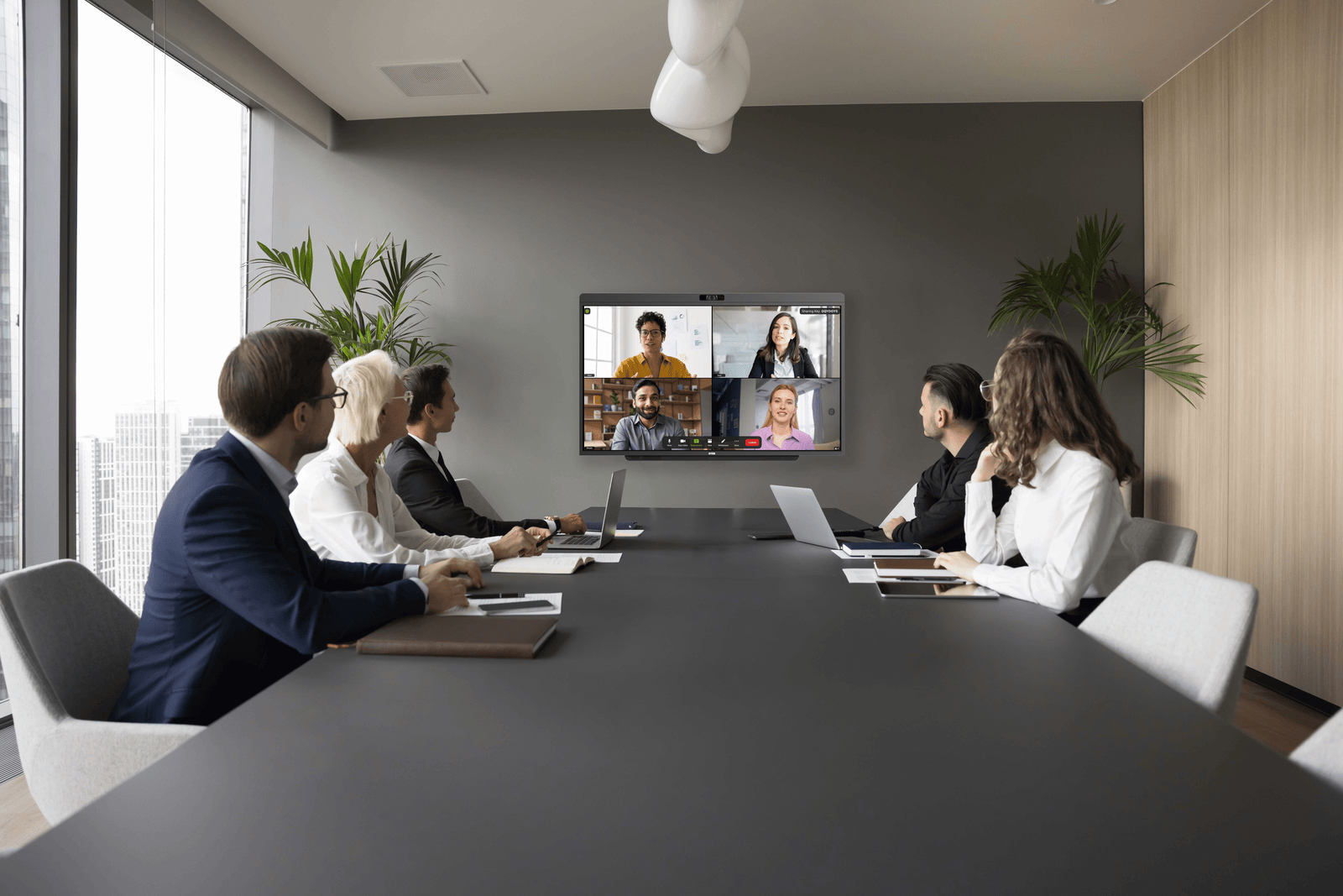 Microsoft Teams Room display showing participant gallery in a conference room